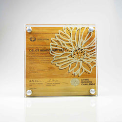 Premium wood and glass wall plaques featuring custom-etched messages and vibrant brand graphics for corporate and sustainability recognition. Made in Canada.
